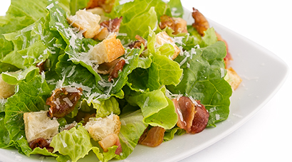 Bed of green oak & romaine lettuce, smoked bacon, homemade mini croutons, shaved parmesan cheese. Large size comes with 2 oven baked garlic knots. (Garlic knots subject to availability. Sometimes we are sold out. Price remains the same regardless.)